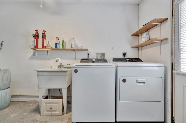 clothes washing area featuring separate washer and dryer