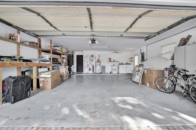 garage with separate washer and dryer and water heater