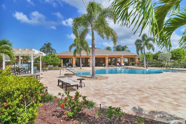 view of pool with a pergola and a patio