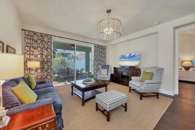 living room with a chandelier and hardwood / wood-style floors