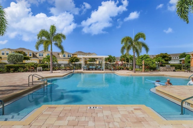 view of swimming pool featuring a gazebo and a patio area