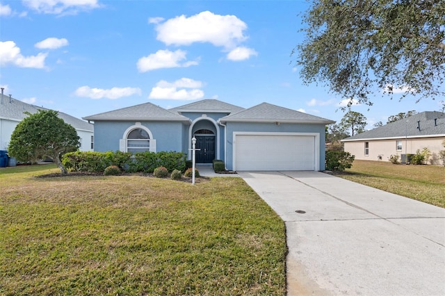 ranch-style home featuring a garage and a front lawn