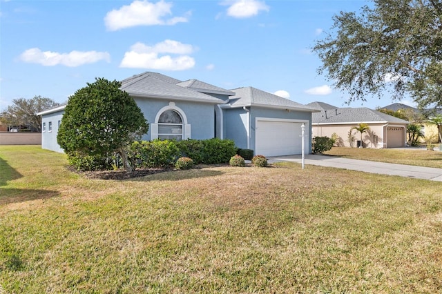 single story home with a garage and a front yard