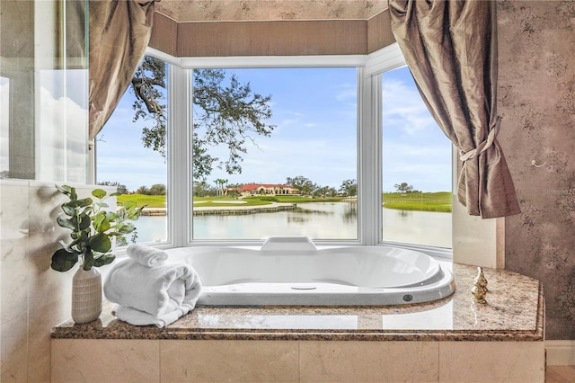 bathroom featuring a water view