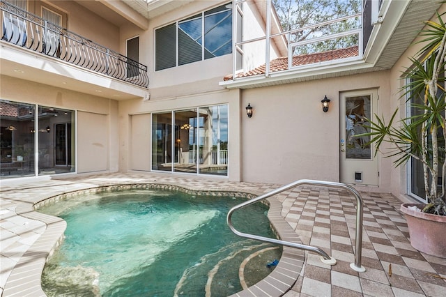 view of swimming pool with a pool and a patio