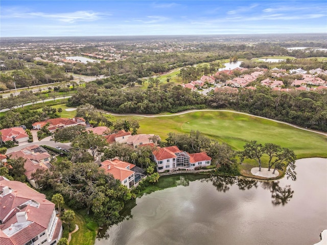 birds eye view of property featuring a water view, view of golf course, and a residential view