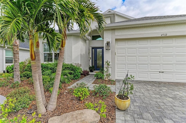 view of exterior entry featuring a garage