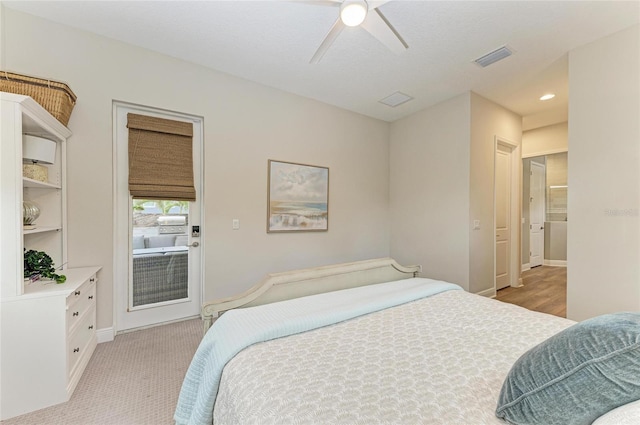 bedroom featuring light carpet, access to outside, and ceiling fan