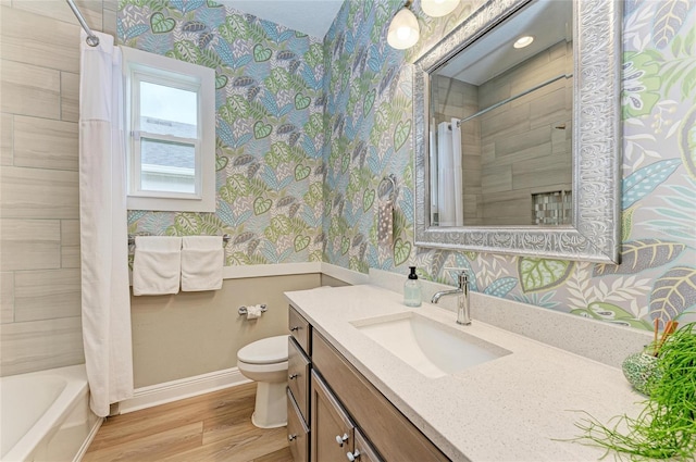 full bathroom with shower / bathtub combination with curtain, wood-type flooring, toilet, and vanity