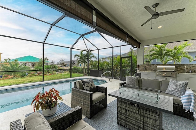 view of patio featuring sink, a lanai, an outdoor living space, grilling area, and exterior kitchen