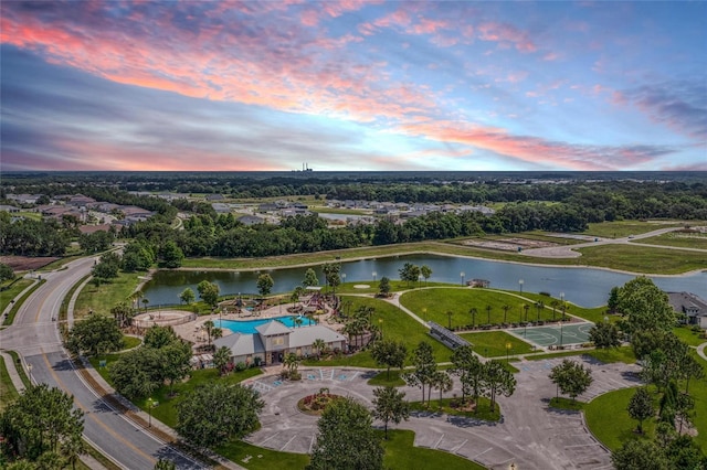 aerial view at dusk with a water view