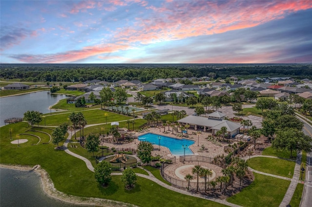 aerial view at dusk with a water view