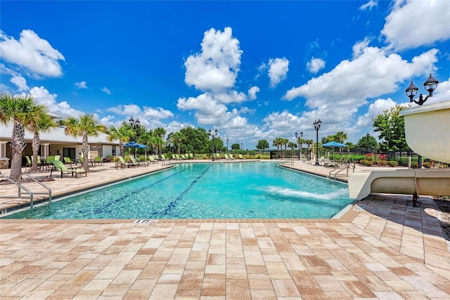 view of swimming pool with a patio area