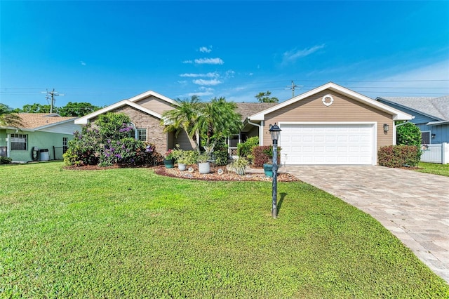 single story home featuring a garage and a front yard