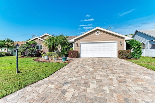 ranch-style house with a garage and a front lawn