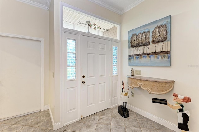 entrance foyer with crown molding and light tile patterned floors