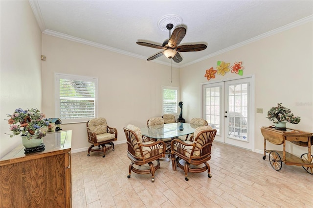 dining room with french doors, ceiling fan, crown molding, and light wood-type flooring