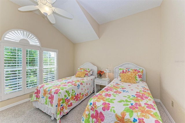 bedroom with ceiling fan, carpet floors, and vaulted ceiling