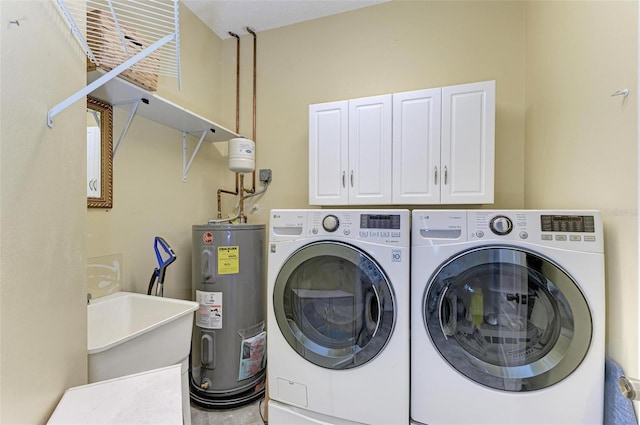 washroom with separate washer and dryer, sink, cabinets, and water heater