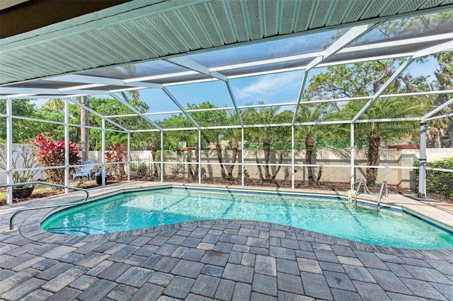 view of pool with a lanai and a patio area