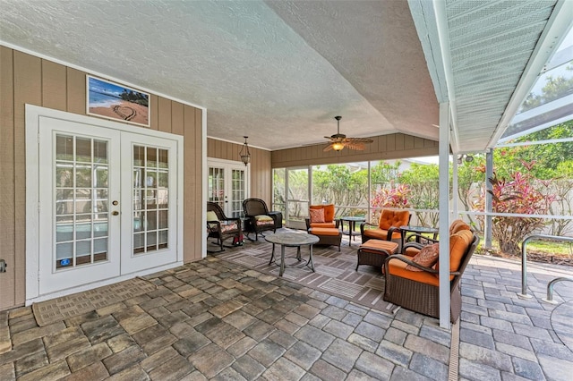 view of patio featuring ceiling fan, outdoor lounge area, glass enclosure, and french doors