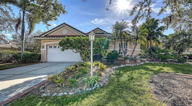 view of front of home with a garage and a front yard