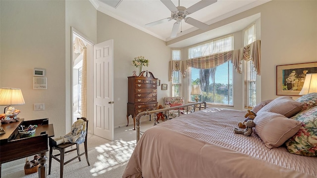 bedroom with crown molding, light colored carpet, ceiling fan, and high vaulted ceiling