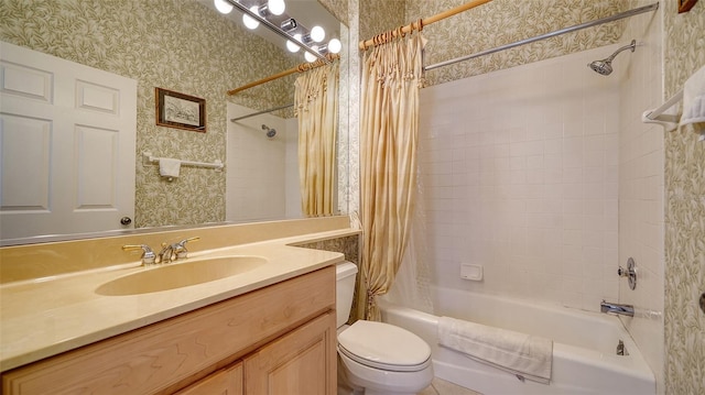 full bathroom featuring vanity, shower / tub combo, and toilet