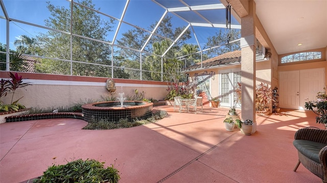 view of patio featuring glass enclosure