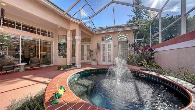 sunroom / solarium with a skylight, a healthy amount of sunlight, and a jacuzzi