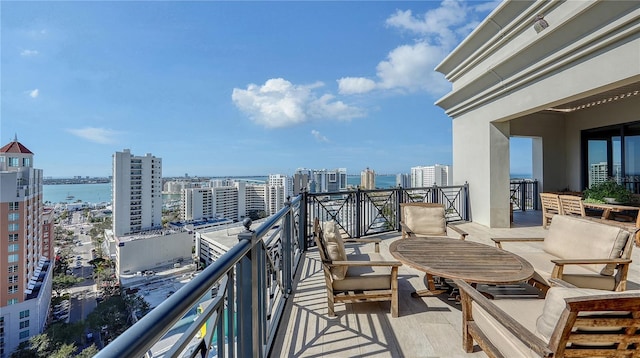 balcony featuring a water view