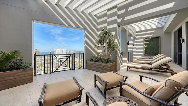 view of patio with a balcony and a pergola