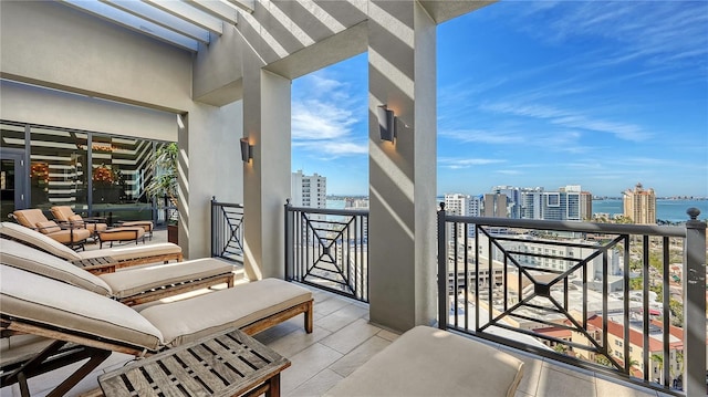 balcony featuring a water view