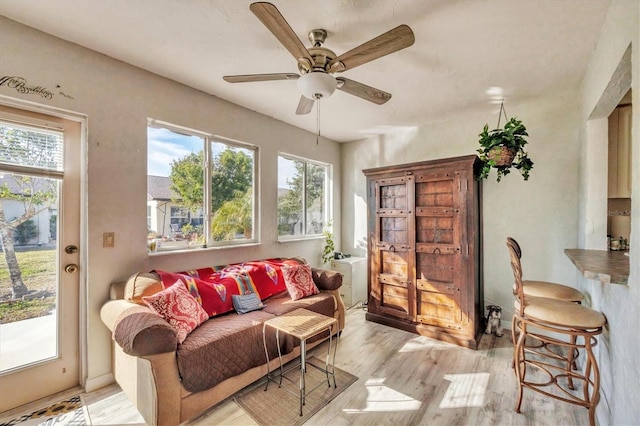 sitting room featuring ceiling fan and light hardwood / wood-style floors