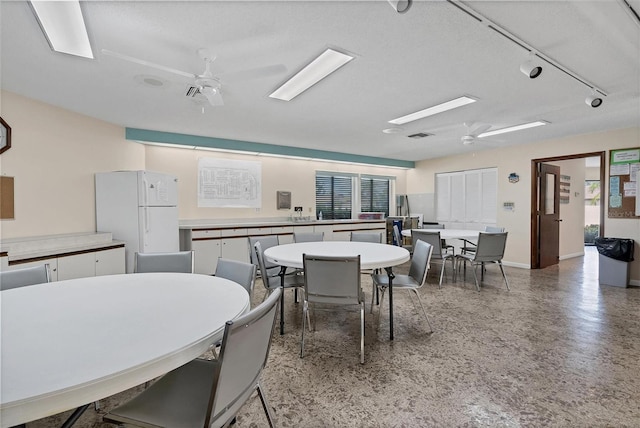 dining space featuring ceiling fan