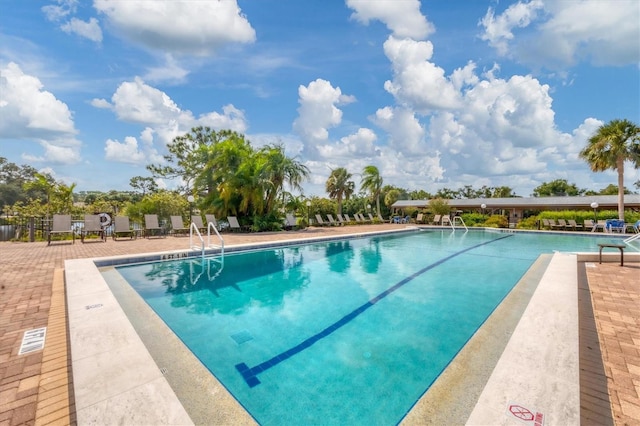 view of swimming pool with a patio