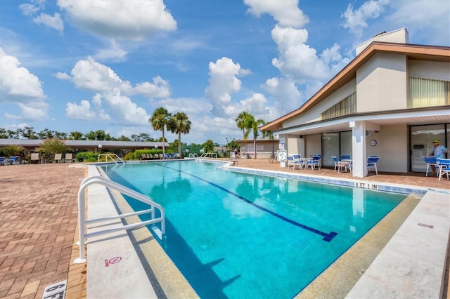 view of pool featuring a patio area