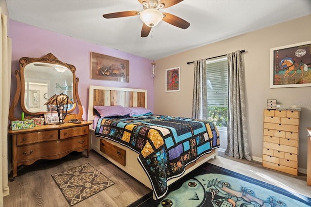 bedroom featuring hardwood / wood-style floors and ceiling fan