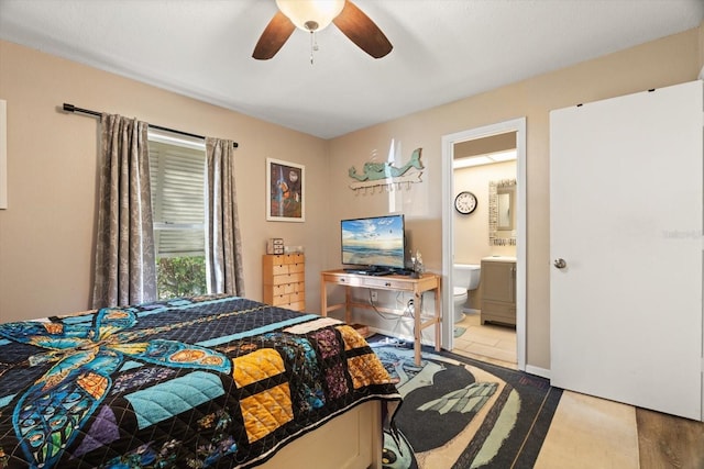 bedroom with ensuite bath and ceiling fan