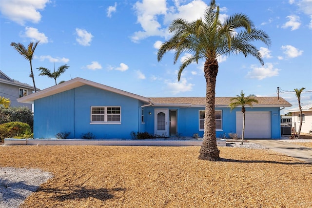 single story home featuring a garage