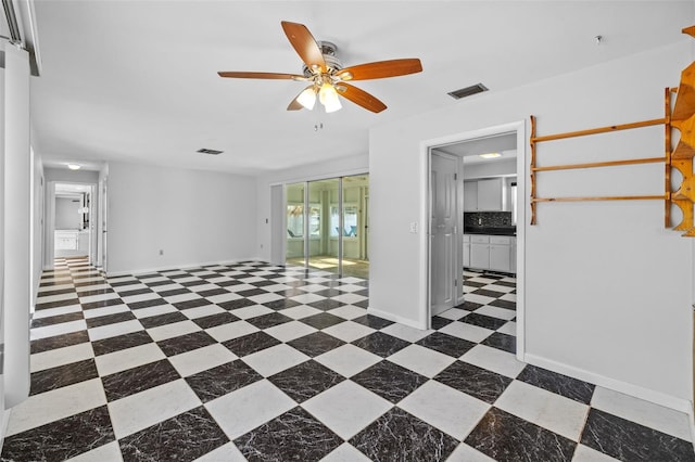 spare room featuring ceiling fan