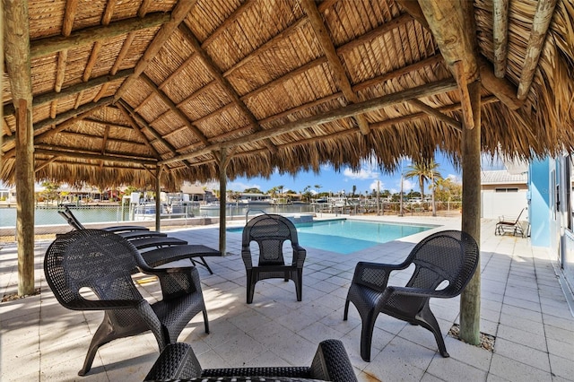 view of swimming pool featuring a gazebo and a patio