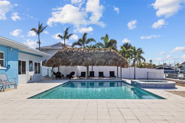 view of swimming pool with an in ground hot tub, a gazebo, and a patio area