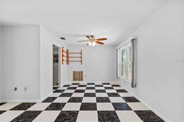 unfurnished room featuring ceiling fan