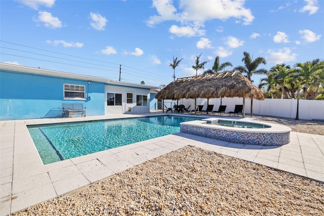 view of pool featuring a patio, an in ground hot tub, and a gazebo