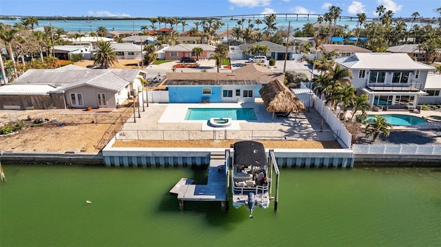 birds eye view of property with a water view