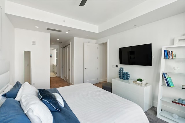 bedroom featuring ensuite bathroom and ceiling fan