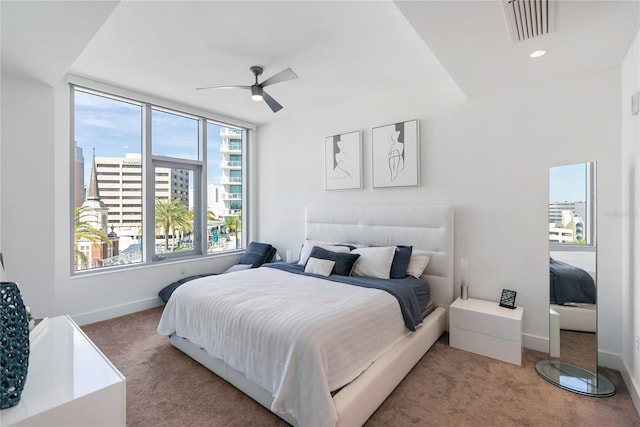 bedroom featuring ceiling fan and carpet