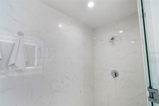 bathroom with tiled shower