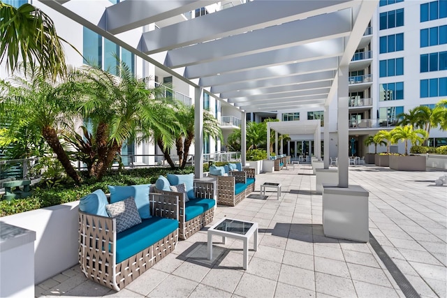 view of patio featuring an outdoor hangout area and a pergola